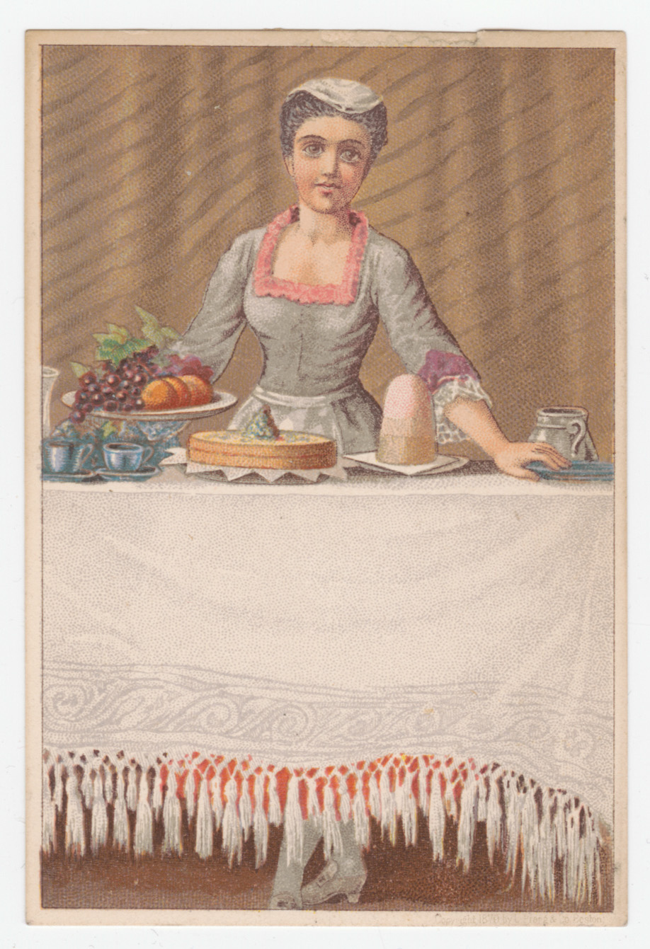 Woman standing behind table with large white tablecloth